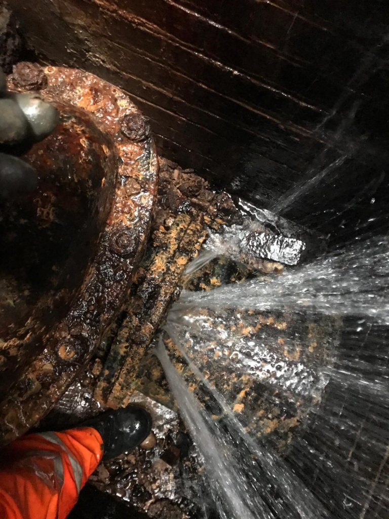 An underground burst carbon steel water main on the UK water network which had not been repaired for 15 years