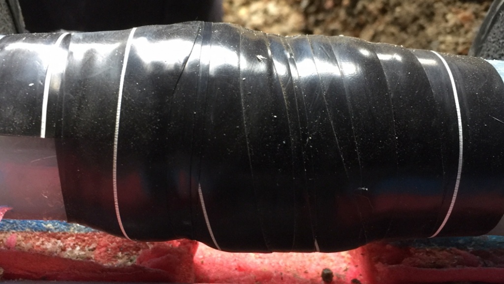 Wrap & Seal Pipe Burst Tape wrapped to a damaged heating pipe on a farm