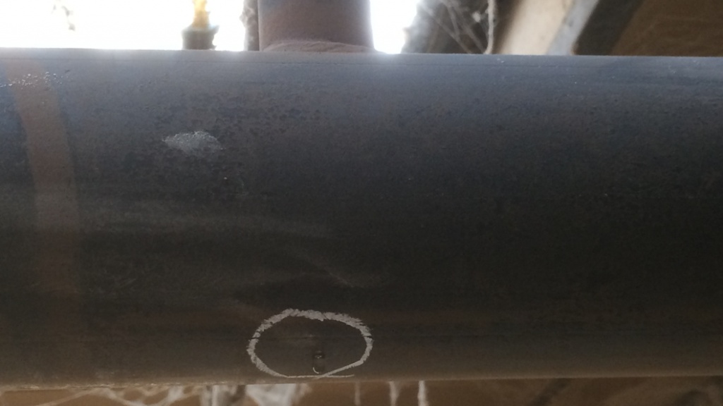 A pinhole leak in pipework connected to sprinklers at a furniture workshop