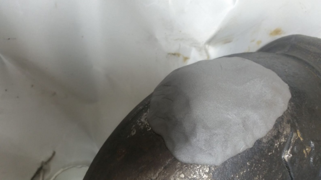 Steel epoxy putty applied to a leaking cast iron wastewater pipe in a London hotel