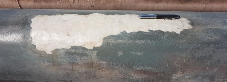 Sylmasta AB Original Epoxy Putty used for pipeline strengthening on a steel pipe degraded and weakened by corrosion