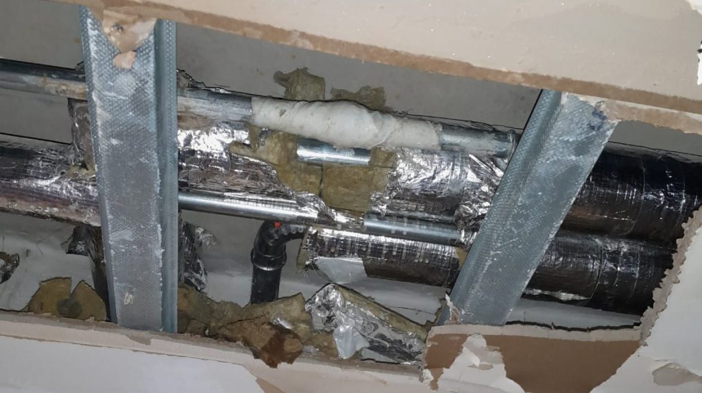 50mm steel pipe within a ceiling cavity as part of a district heating system having undergone successful repair with a SylWrap HD Bandage
