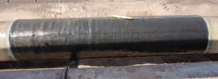 SylWrap CR applied for the reinforcement of a steel pipe and to protect it from corrosion at an industrial site in Saudi Arabia