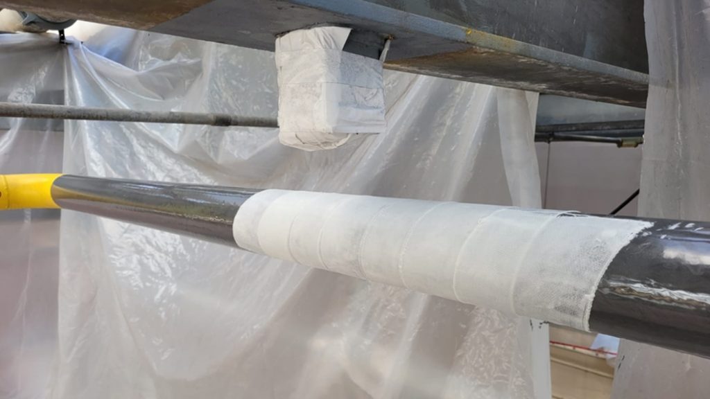 SylWrap HD Pipe Repair Bandage wrapped over a heavily corroded section of steel pipe carrying natural gas in a CHP system