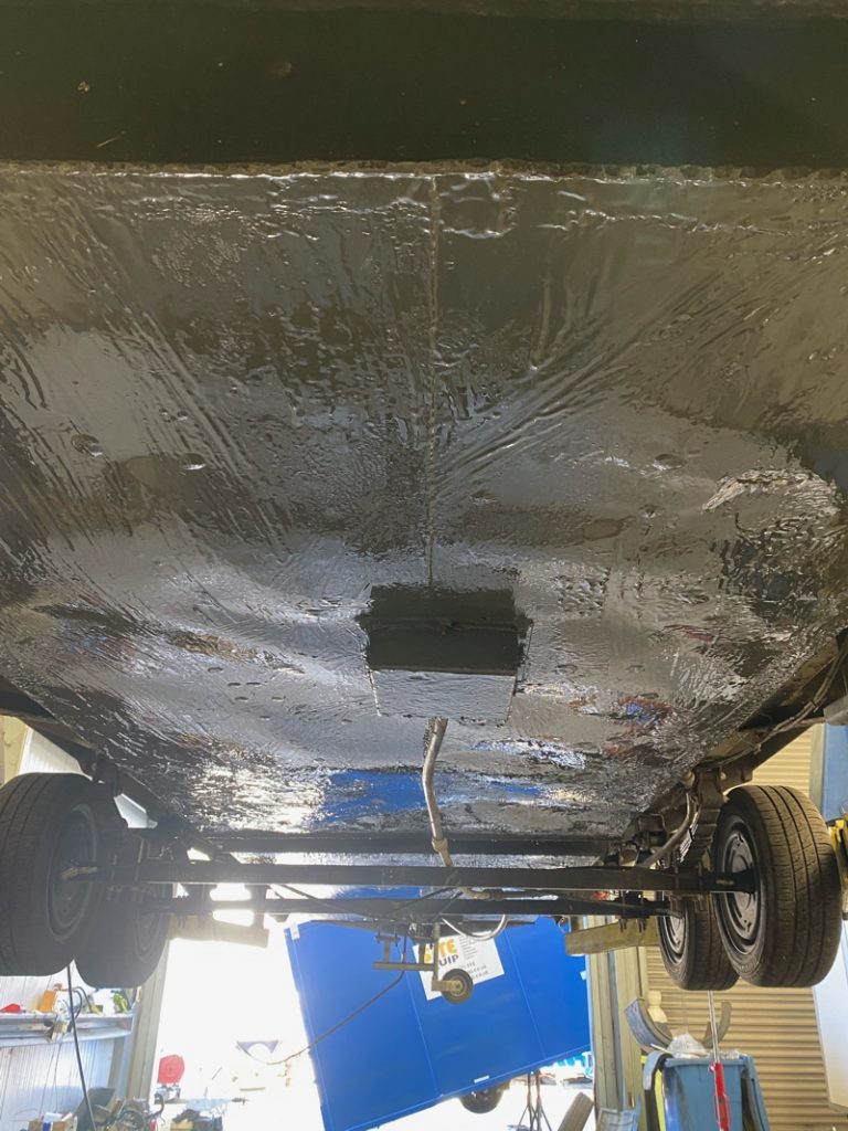 Liquid Metal Epoxy Coating brush applied to repair and refurbish a portable toilet trailer