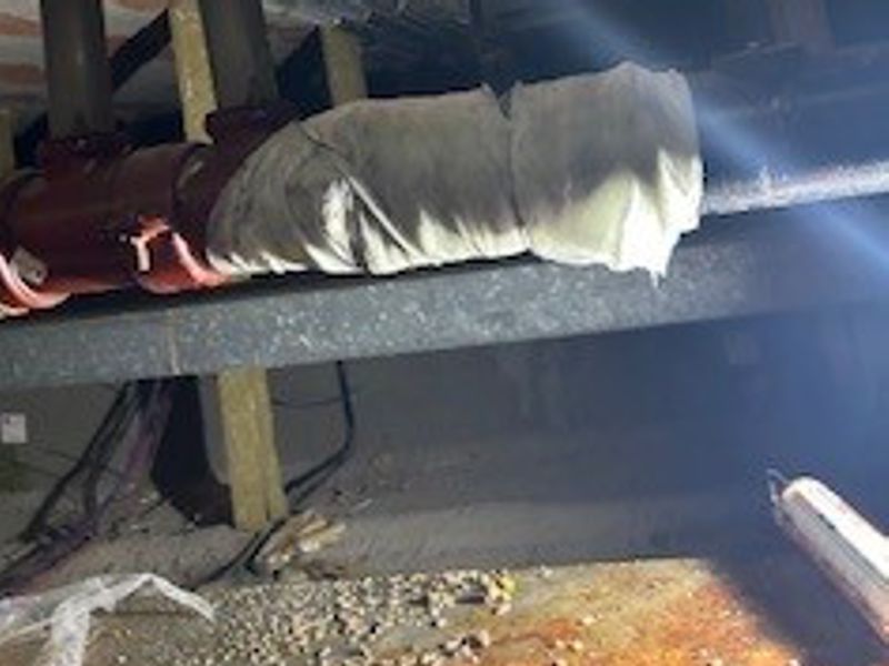 SylWrap HD Pipe Repair Bandaged wrapped over an 80mm hole in a cast iron wastewater drain pipe at a hospital