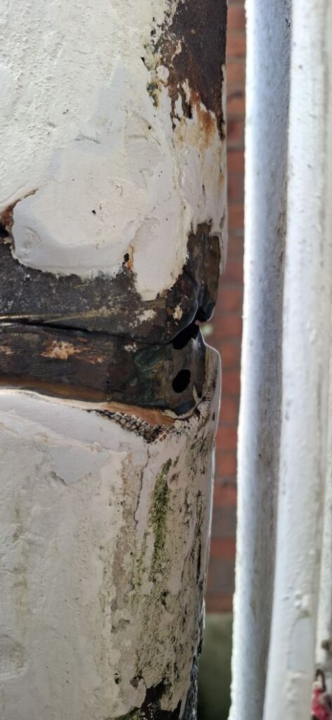 A large crack in a soil vent pipe undergoes repair by packing out the damage with Sylmasta AB Original Epoxy Putty