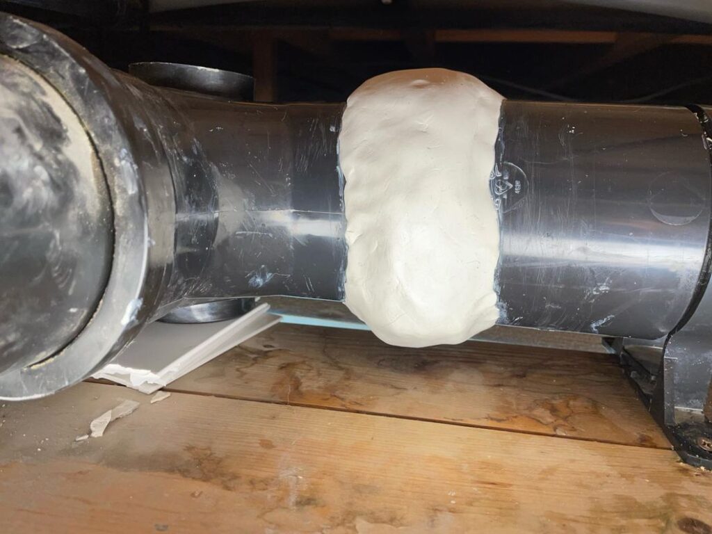 AB Original Epoxy Putty used to repair a leaking plastic pipe in a loft suffering from solvent cement failure